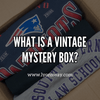 Graphic with the text 'What is a Vintage Mystery Box?' showcasing sustainable and stylish vintage fashion options.