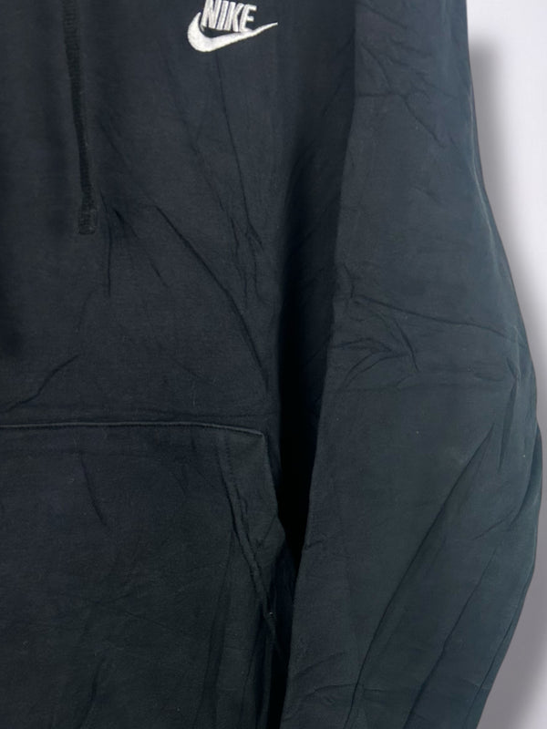 Black Nike hoodie with a white logo on a light gray background