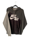 Gray and black Nike Air hoodie on a hanger against a white background