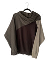 Hoodie with color-block design on a hanger against a white background